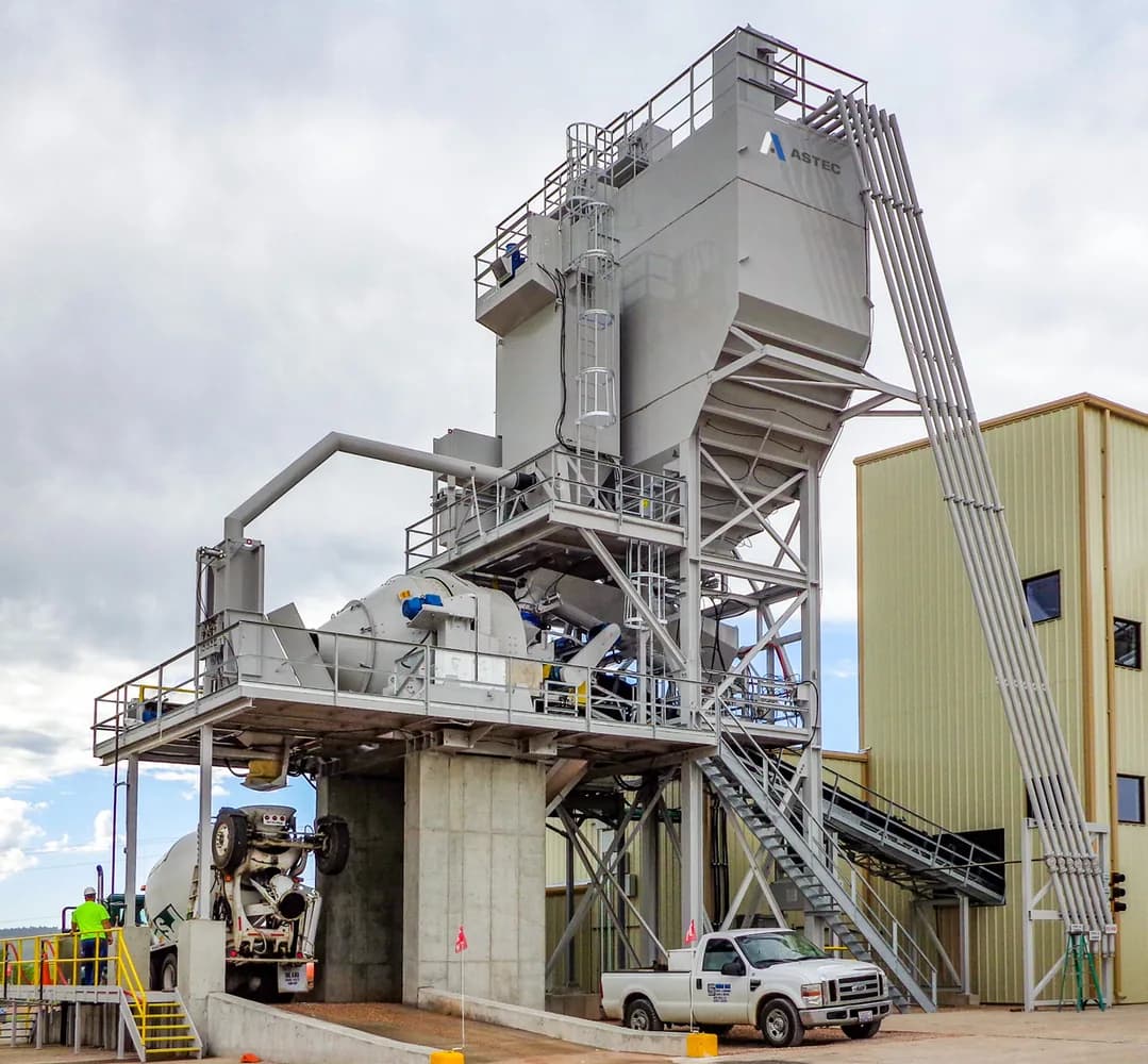 CON-E-CO SLP central mix plant detail showing mixer, cement storage, and maintenance platforms