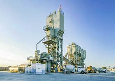 CON-E-CO SLP wide ready-mix yard with plant, aggregate bin, mixer truck, and loader