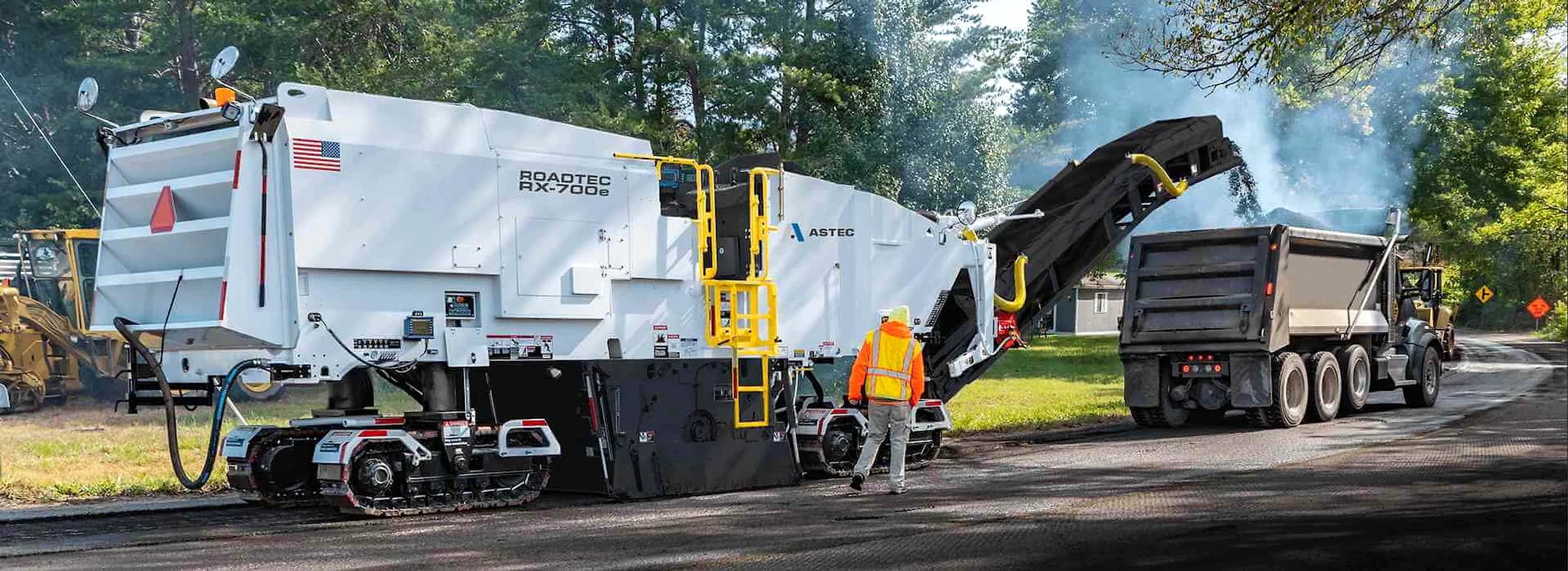 Roadtec RX-700 cold planer loading milled asphalt into a haul truck