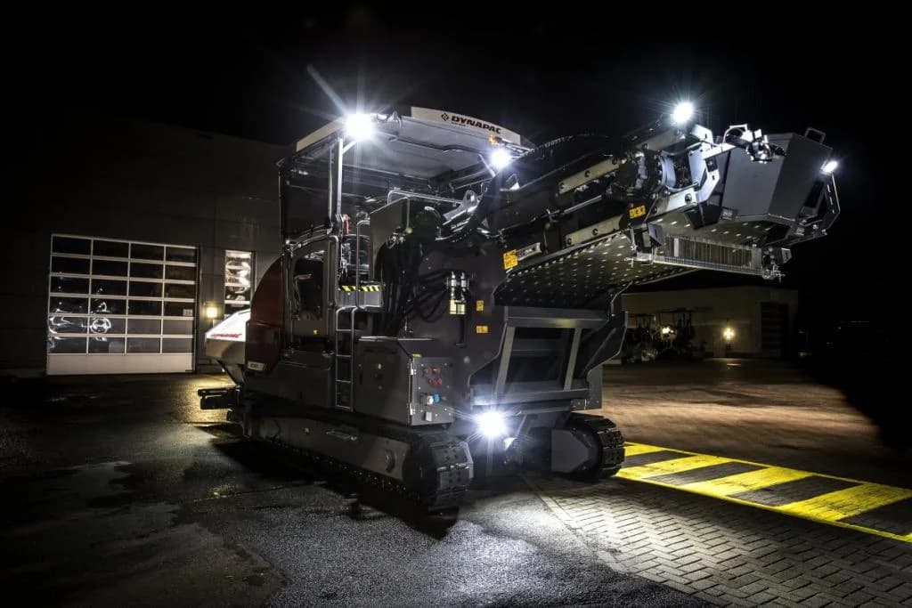 Dynapac MF2500CS with SW6500 Swing Feeder night paving application OEM photo