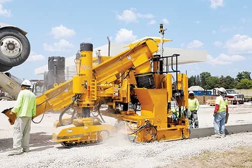 GOMACO GT-3600 trimmerhead and conveyor working before curb and gutter placement