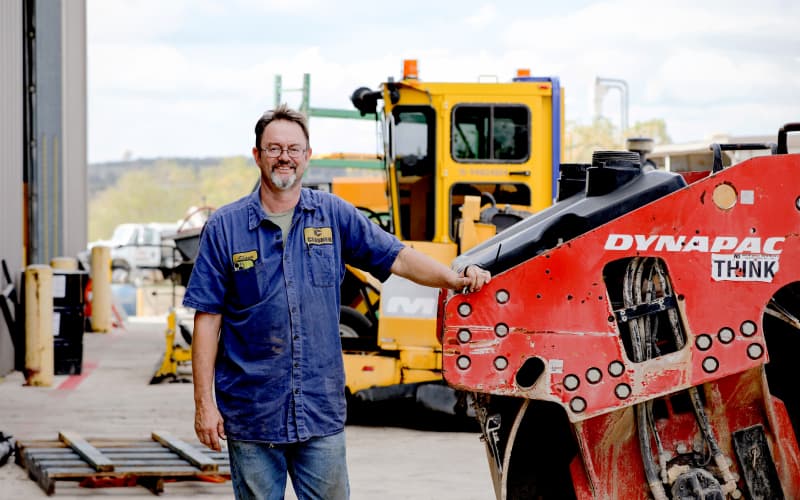 Closner Equipment product support technician with Dynapac roller